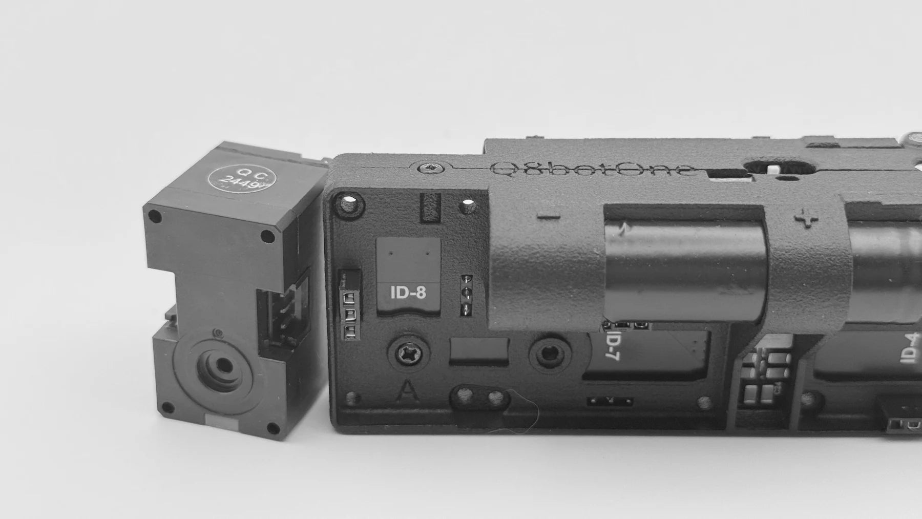 Close-up of Q8botOne showing DYNAMIXEL actuators and integrated body hardware