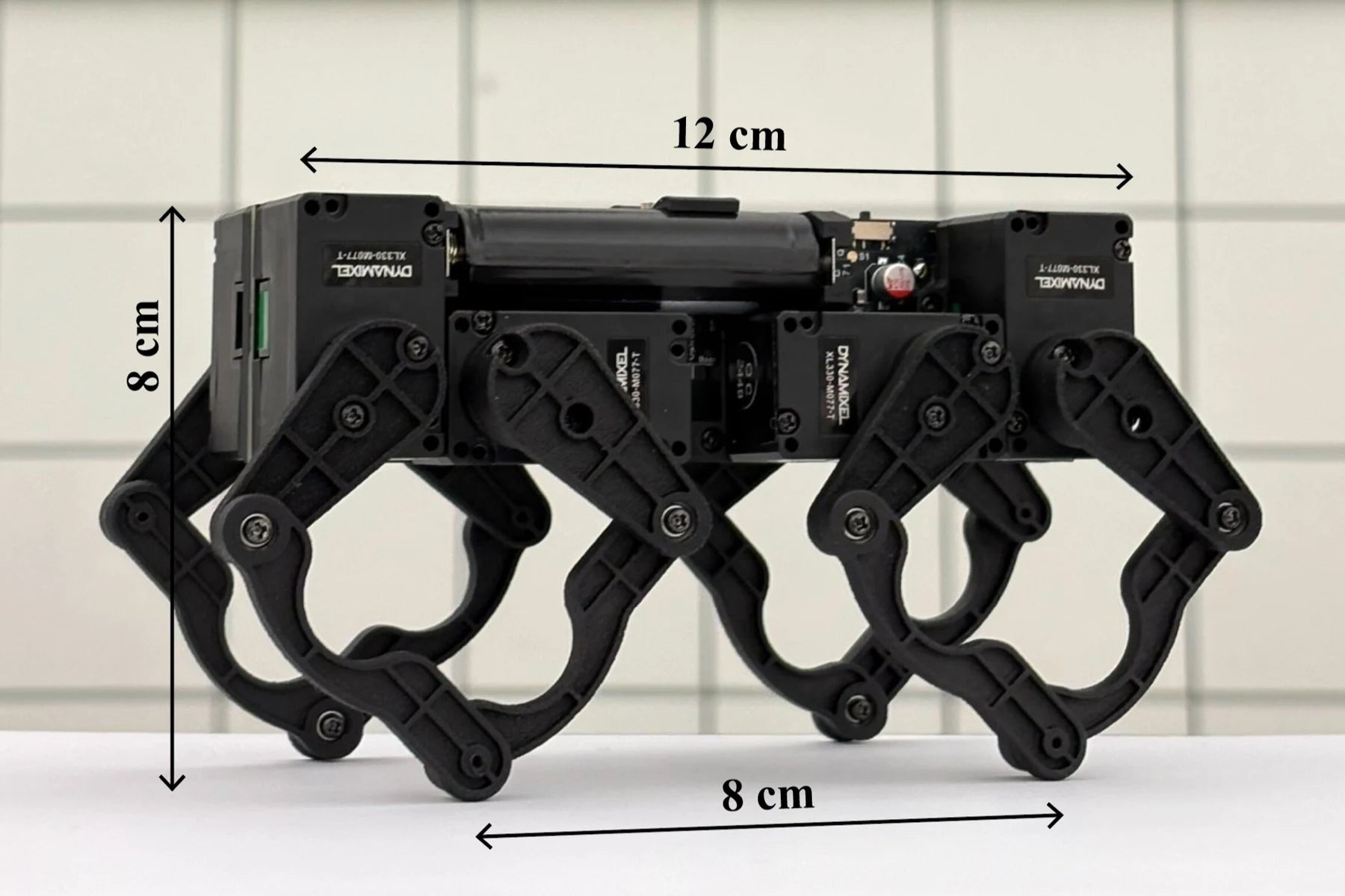 Original Q8bot dimension image marked 12 cm long and 8 cm tall